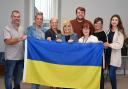 Ukrainian refugees are pictured with the council team in Kilwinning's Cranberry Moss Community Centre