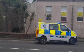 A police vehicle beside the steps to Castle Hill this evening