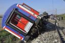 An overturned train car is seen near a village at Tekirdag province, Turkey (Mehmet Yirun/DHA-Depo Photos via AP)