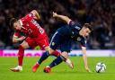 Vadim Rata (left) tussles with Scotland's Billy Gilmour during a World Cup qualifier match between Scotland and Moldova at Hampden