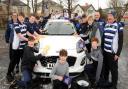 The rugby team at the car wash last weekend