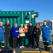 The defibrillator is officially handed over to the community hub.