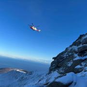 The mountain rescue team helicopter making its way to the incident.
