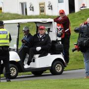 Trump on his buggy at Turnberry
