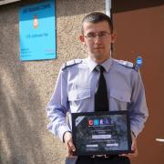 Flying Officer David McKay with his award