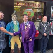 Robert Burns looks in as Ronnie Stalker receives his award from Martin Cassidy (President of the Haggis Association) with Marc Sherland (President of the Robert Burns World Federation) and Danny McInnes (Dalry Burns Club)
