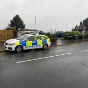 Police cordoned off an area of the car park and around the adjacent flats this morning.