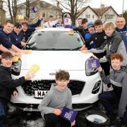 The rugby team at the car wash last weekend