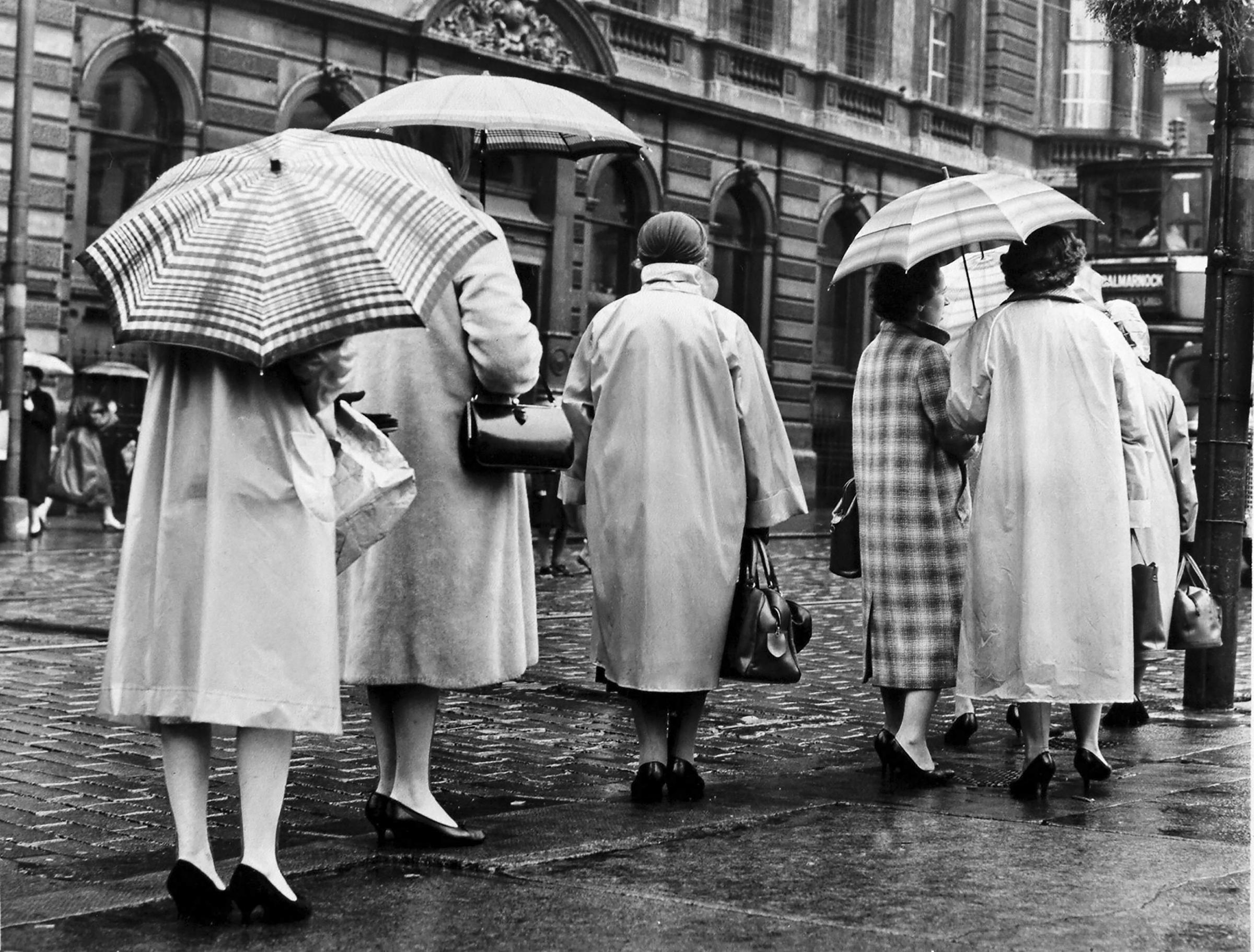 Some stylish brolly action here on a rainy Glasgow street in 1959. Pic: Herald and Times