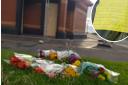 Floral tributes laid at scene where woman lost her life in public toilets fire