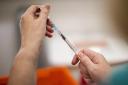 Vaccinator Rosie Buchanan prepares a vial of the Pfizer/BioNTech COVID-19 vaccine at the COVID-19 vaccination centre at Dundonald Hospital in Belfast, Northern Ireland..