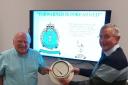 Holding a piece of nuclear history...former Royal Observer Corps Lieutenant, Frank Alexander (right) shows Rotary Club interim President Jim Jackson a nuclear bomb power indicator used to record the maximum over-pressure of the blast wave