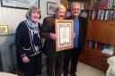 John Mitchell (centre) with his Papal blessing, pictured with his wife Rose Ann  and Canon Martin Poland