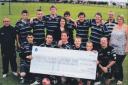 Ardrossan Accies youth players received a cheque from  the Hunterston A team