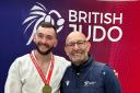 Scott with his gold medal alongside his dad Billy Cusack, who is his coach and a former Olympic judo star
