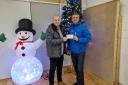 NASA chair Mark Wilson hands a cheque to Eddie Gorman from Harbour Ayrshire