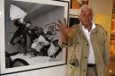 Harry Benson stands in front of his 1964 photograph of the Beatles Pillow Fight, at the Pacific Design Center in West Hollywood, California on March 24, 2008