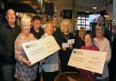 The cheques from the bar are handed over to Hazel Gallagher and Elizabeth Morrice Sense Scotland with Betty Hardie and Anne Blades of the Whitlees Centre