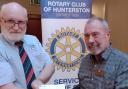 Gerard McGlumpha receives the Rotary Club of Hunterston Community Award cheque from President Alex Blair