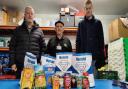 Alan Caldwell, Jim Smith and Euan Temporal from the North Ayrshire Foodbank team with just a few of the hundreds of items donated by kind-hearted readers of the Herald