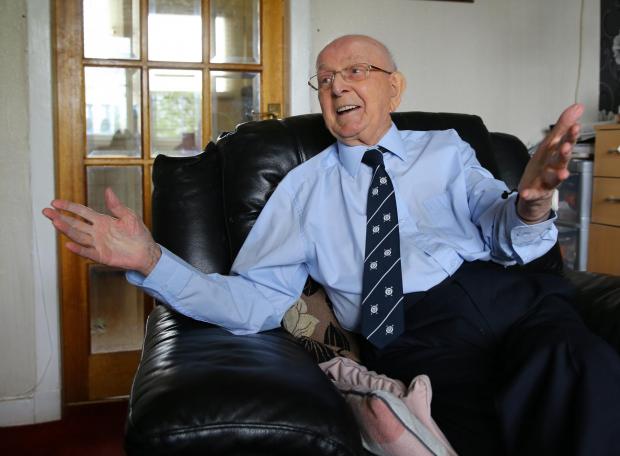 Ardrossan and Saltcoats Herald: Bobby Dinnie MBE age 89 pictured at home in Possil. Bobby, a retired football scout, was involved with the Possil YM football team for over 60 years and was responsible for discovering footballers Kenny Dalglish, Alan Archibald, Tony Fitzpatrick among