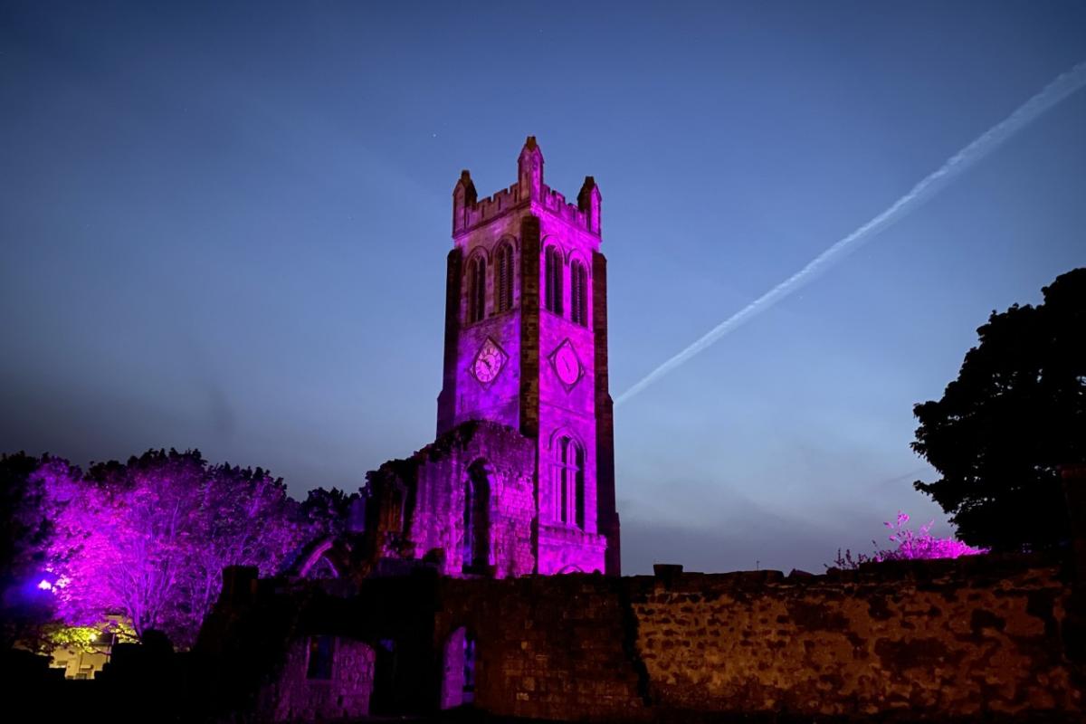 Kilwinning Abbey tower goes purple