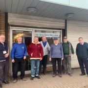 The Three Towns Men’s Shed outside their new base in Glasgow Street