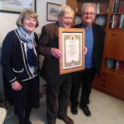 John Mitchell (centre) with his Papal blessing, pictured with his wife Rose Ann  and Canon Martin Poland