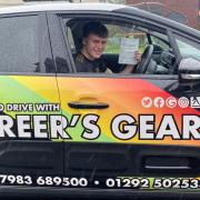 Ben Doak celebrates after his first-time driving test pass.