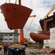 The first of two ferries being built at the troubled Scottish Government-owned shipyard Ferguson Marine was due to be in service by the spring.