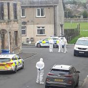 Police were present at the scene of the incident wearing protective clothing.