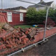 Images have shown a damaged wall around the area the car involved in the alleged incident was recovered.