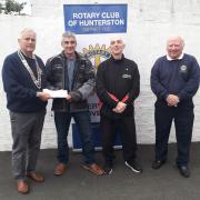 John Deans and Andrew Barclay from the Shibumi Karate Club in Saltcoats who received their award from then Hunterston Rotary Club President Derek Andrews (left) and Community Convenor Jim Jackson.