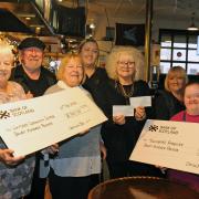 The cheques from the bar are handed over to Hazel Gallagher and Elizabeth Morrice Sense Scotland with Betty Hardie and Anne Blades of the Whitlees Centre