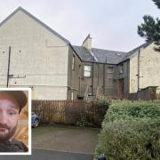 Police searched a block of flats in Ardrossan as part of their investigation into the murder of Alan Lawson.