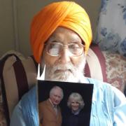 Ajaib with his card from the King and Queen