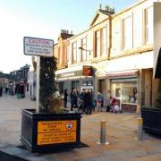 Kilwinning town centre and, inset, the late Cllr Glover