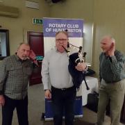 Listening intently to Kenny Macleod of McCallum Bagpipes (centre) are Alex Blair, President of the Rotary Club of Hunterston (left) and fellow Rotarian George Dodds.