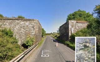 The two stone abutments used to form part of a railway line over the B778 from Kilwinning to Dalry - but now pose a risk to safety