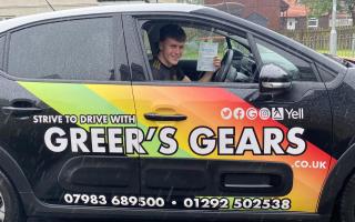 Ben Doak celebrates after his first-time driving test pass.
