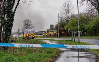 Emergency crews remain at the scene of a fire which broke out at a battery recycling plant in Kilwinning.